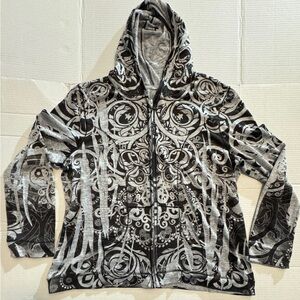 Gently worn woman’s lightweight zippered hoodie with design.